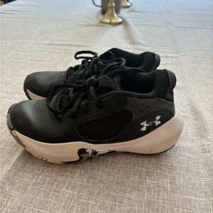 Boys black and white Under Armour tennis shoes size 12